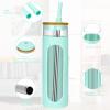 imageTronco 20oz Glass Tumbler with Bamboo Lid and Straw Glass Cup For BobaIced CoffeeSmoothie Spill Proof Glass Water Bottle With Silicone Protective Sleeve Dishwasher SafeBPA FreePureBlue