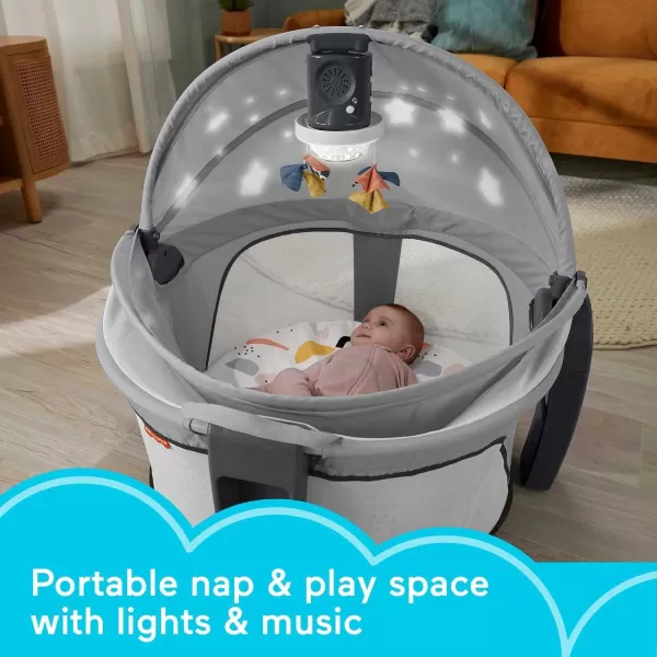 FisherPrice Portable Baby Bassinet Deluxe OnTheGo Projection Dome Travel Play Space for Newborns with Lights Music ampamp Canopy Paper ShapesGray