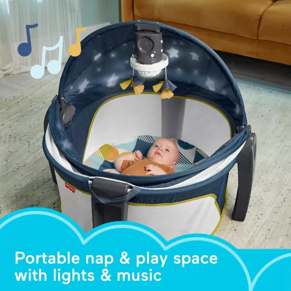 FisherPrice Portable Baby Bassinet Deluxe OnTheGo Projection Dome Travel Play Space for Newborns with Lights Music ampamp Canopy Paper ShapesNavy