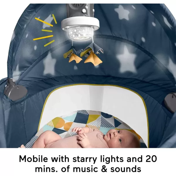 FisherPrice Portable Baby Bassinet Deluxe OnTheGo Projection Dome Travel Play Space for Newborns with Lights Music ampamp Canopy Paper ShapesNavy