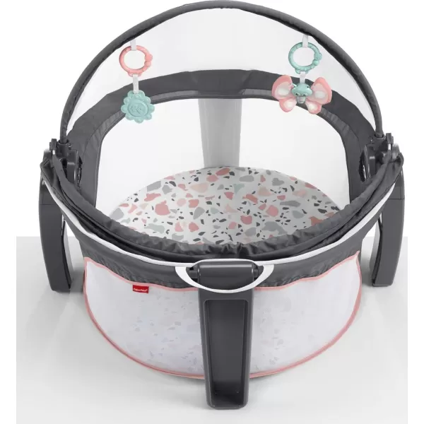 FisherPrice Portable Bassinet OnTheGo Baby Dome Travel Play Space with Developmental Newborn Toys ampamp Canopy Pink Pacific Pebble