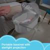 imageFisherPrice Portable Baby Crib Soothing View Projection Bassinet with Lights Music Vibrations ampamp Slim Fold for Newborns 0 Months Fawning LeavesFawning Leaves
